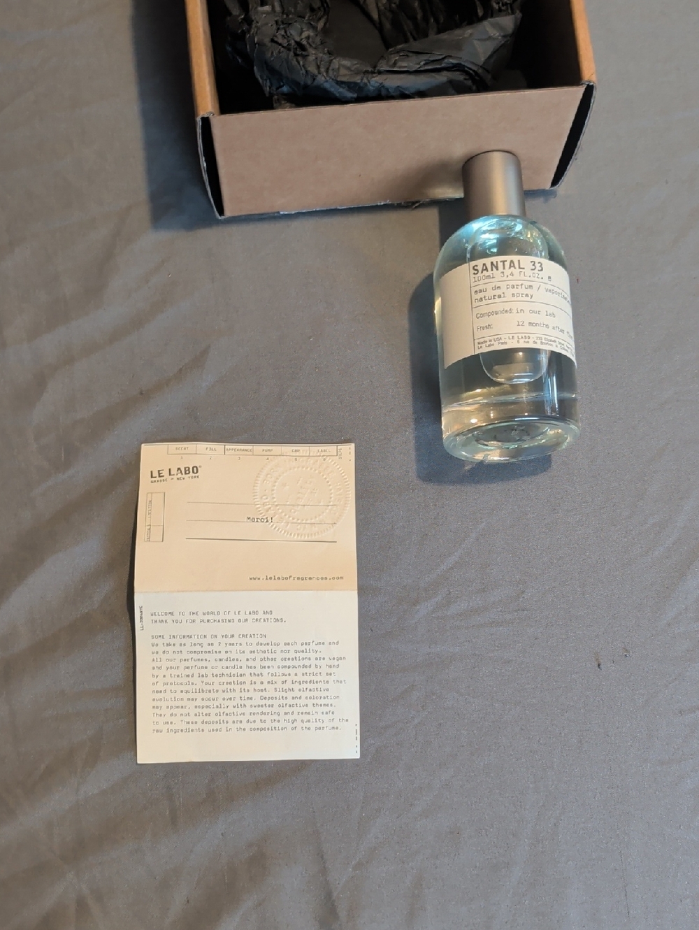 Le Labo Santal 33 Bottle with Paper Insert — Clear and Silver